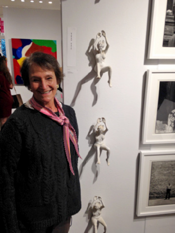 Sarah Katz with her installed sculpture Leaping Ladies at The Affordable Art Fair
