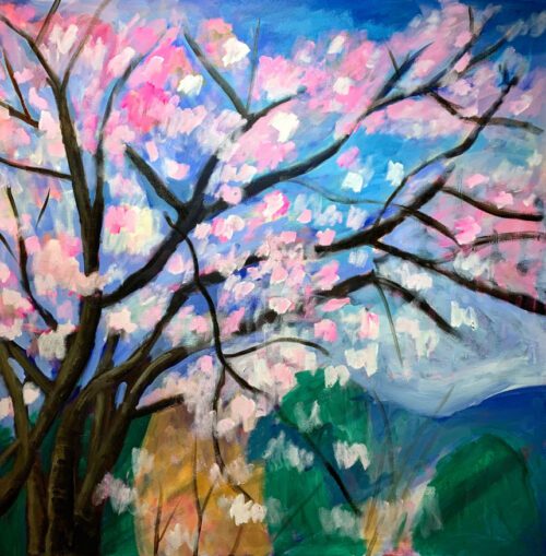 a tree with pink blossoms against a blue sky