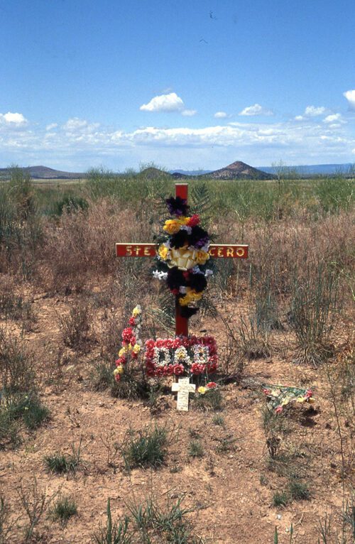 photograph of cross in desert