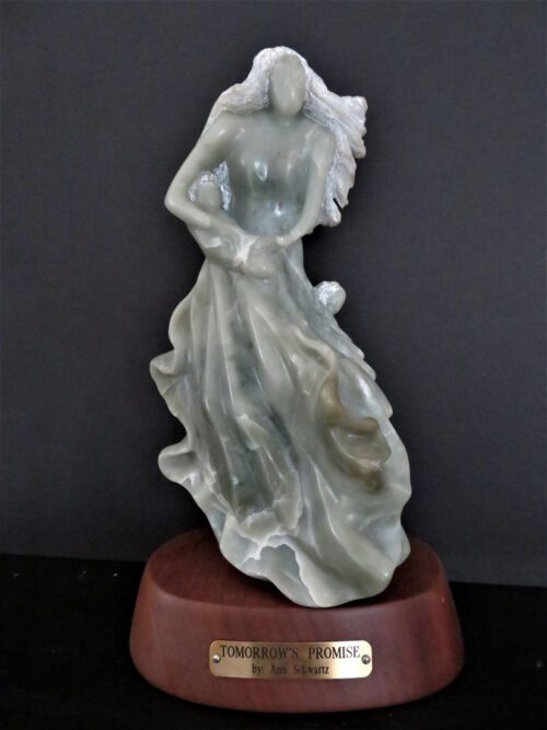 sculpture of woman with flowing gown