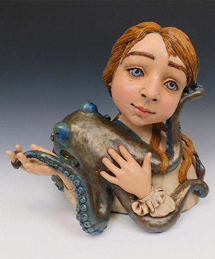 sculpture of girl holding octopus