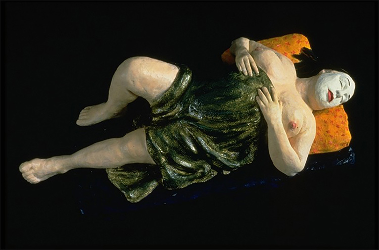 sculpture of woman reclining