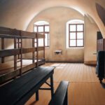 8.  Involuntary Confinement, Sanitized (Gestapo Prison, Terezin, Czech Republic), oil on canvas, 36 x 60